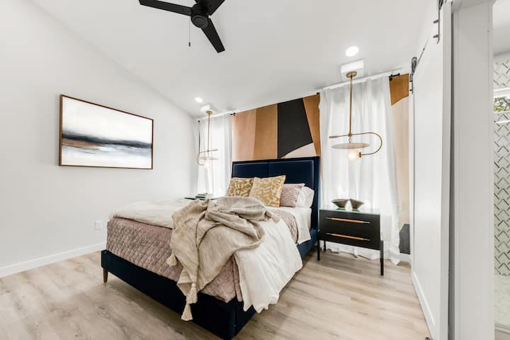 Bedroom 4 - Black bed frame with neutral tones