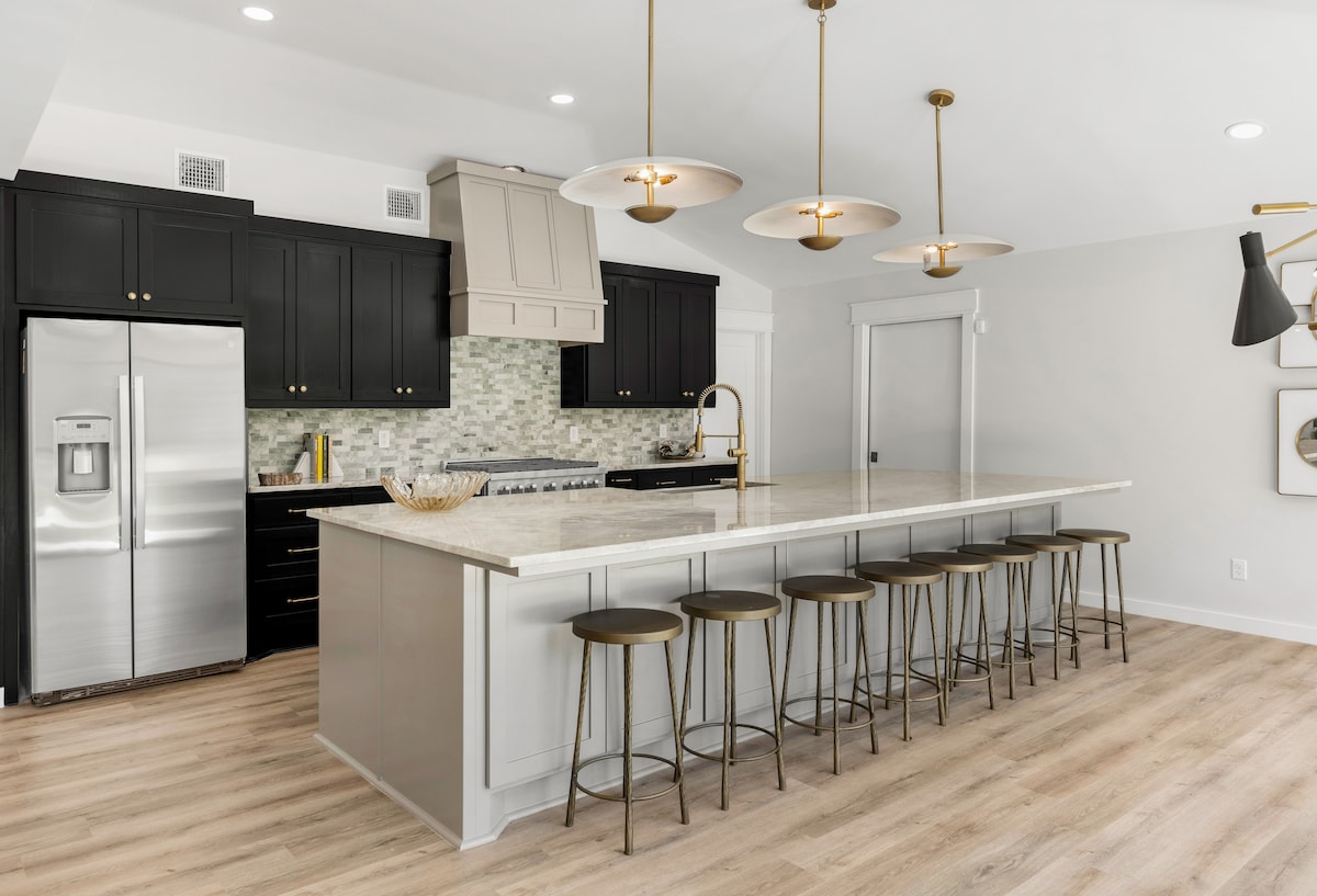 Gourmet kitchen with large island and panoramic nature views